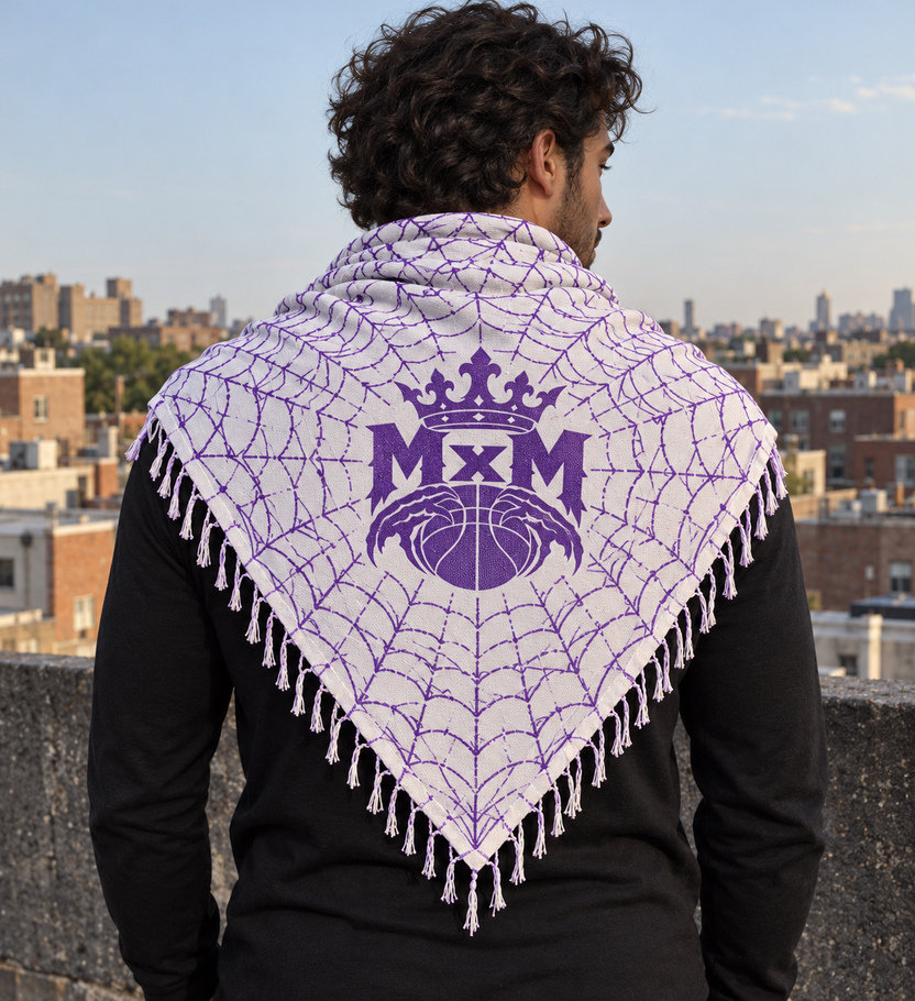 White & Purple MxM keffaya back MxM logo exact brown template, unique model on rooftop beside dark concrete parapet overlooking brick neighborhood
