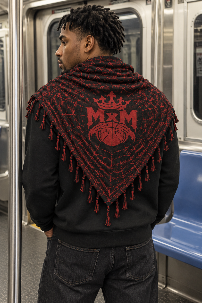 Black & Red MxM keffaya back MxM logo view, unique model standing inside subway car beside stainless steel pole, empty blue bench at side