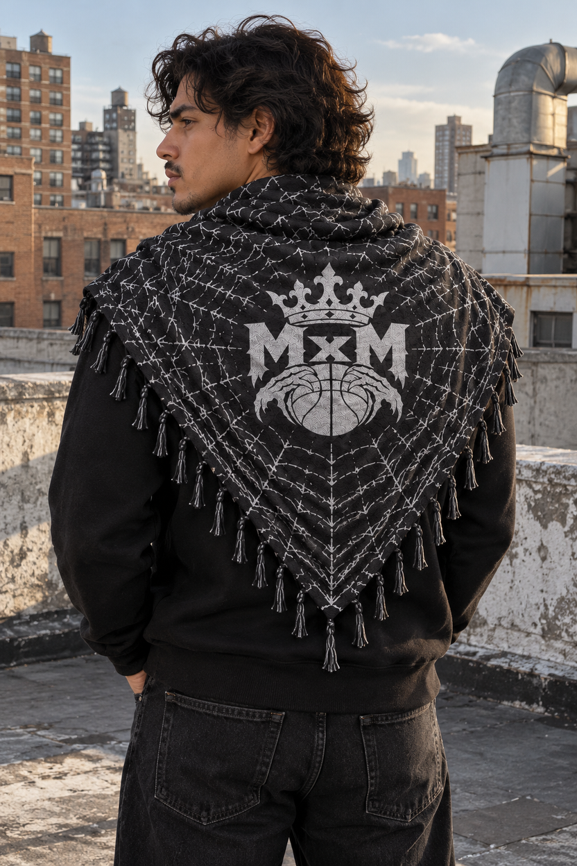 Black & White MxM keffaya back MxM logo view, unique model on ordinary rooftop with weathered concrete parapet, brick apartment buildings and ventilation ducts