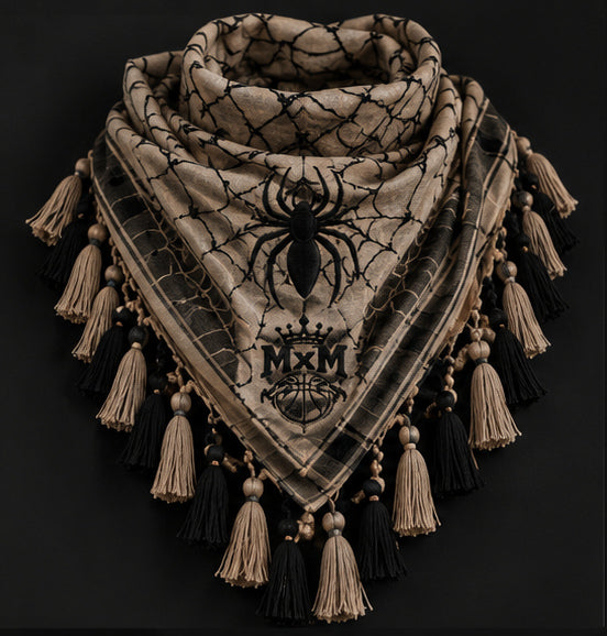 MxM webbed keffiyeh tan black product front. Crowned MxM logo appears on front only; back features woven web pattern and knotted fringe; photorealistic preorder design mockup.