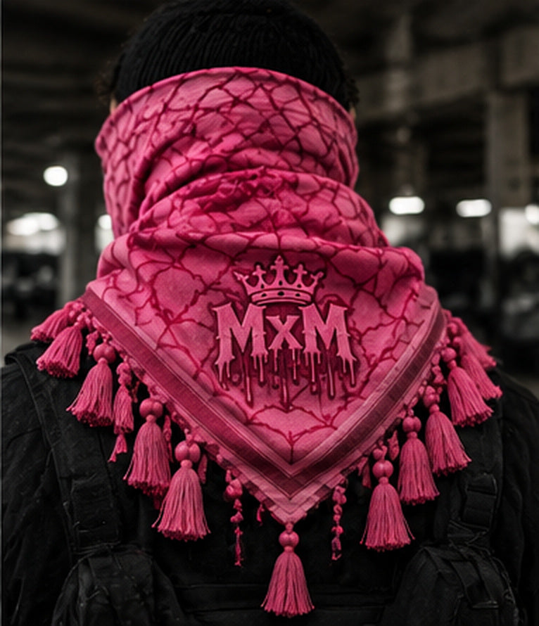 Pink MxM spiderweb keffiyeh on model, back: crowned MxM logo displayed on the rear drape with knotted fringe; photorealistic design preview.