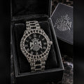 MxM round iced watch in Black finish with matching black MxM presentation box; photorealistic preorder design mockup.