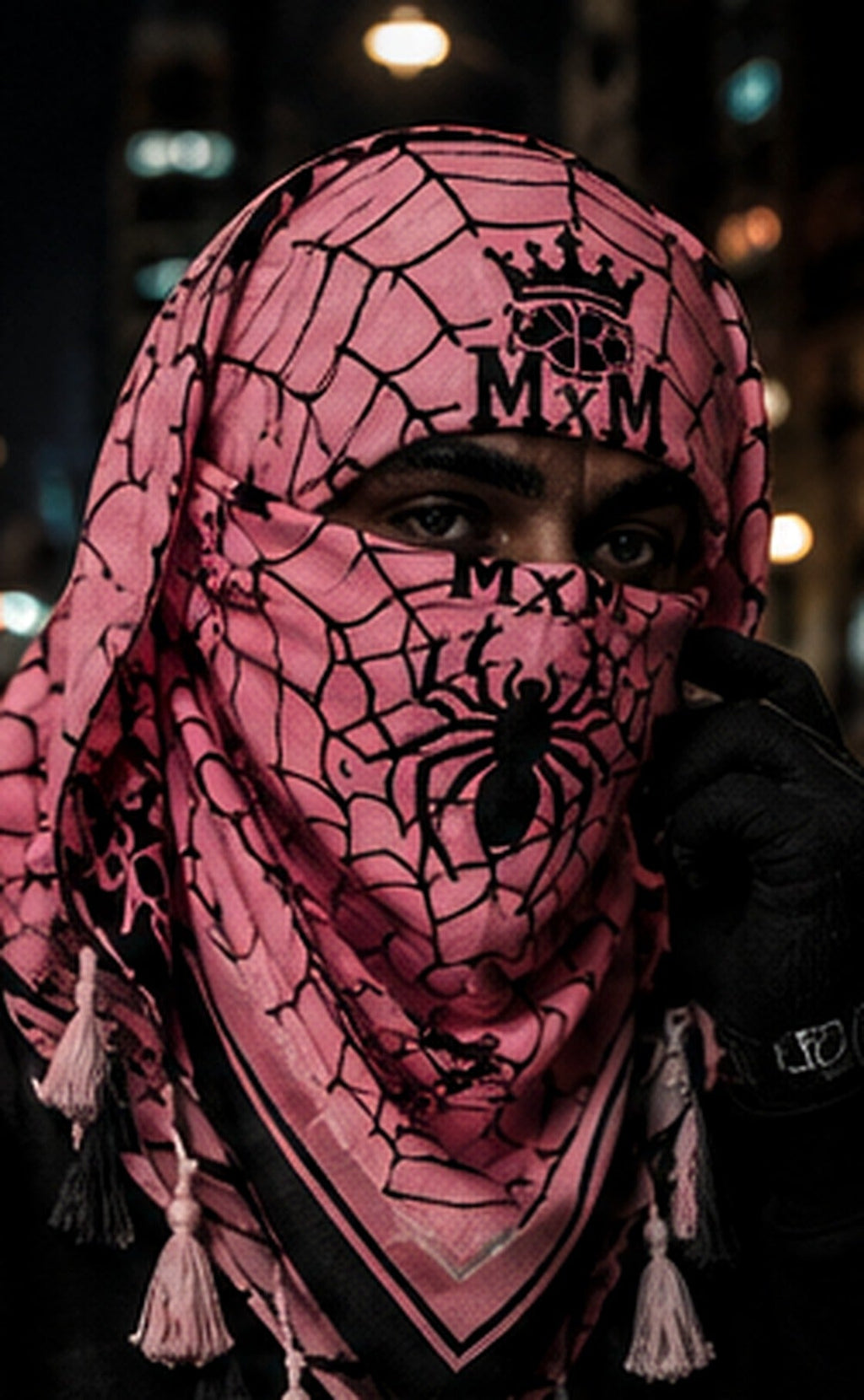 Pink — model wearing MxM spider mask and webbed keffiyah; product concept visualization