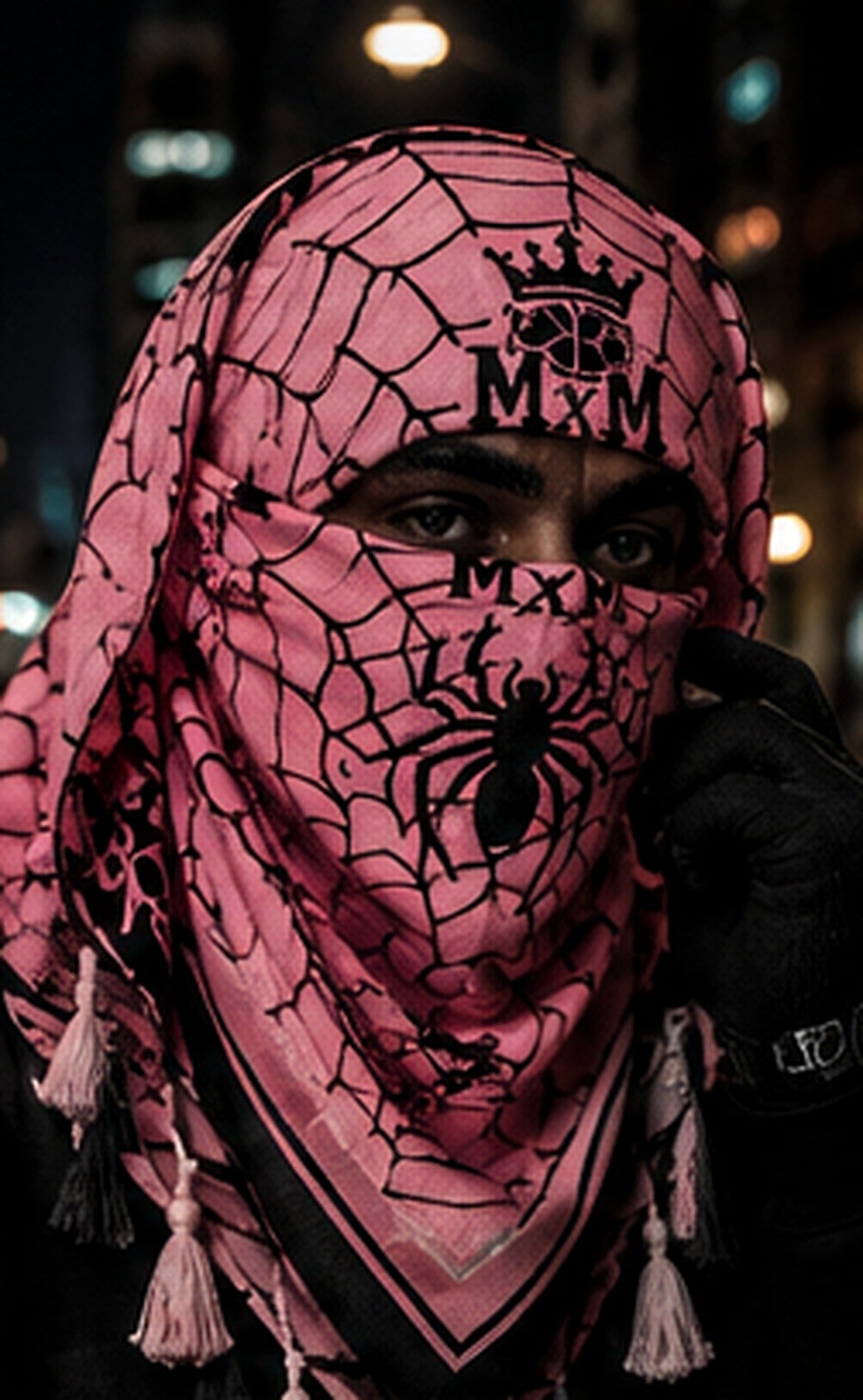 Pink — model wearing MxM spider mask and webbed keffiyah; product concept visualization